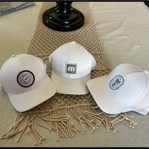 Three golf hats (2 Travis Mathew and 1 Rose Bowl)